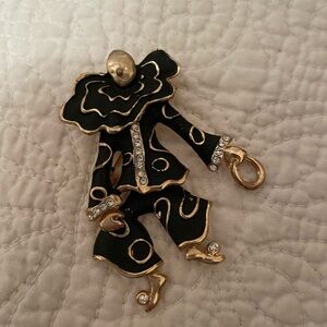 1980s Black clown pin/brooch with gold and crystal/white stone accents.
